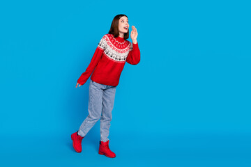 Full length body size photo woman telling secret looking blank space in red pullover isolated bright blue color background