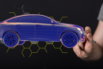 Man holding and touching holographic smart car