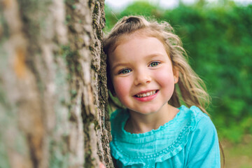 little girl in the summer on nature little girl