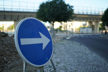 Selective of a blue traffic sign in the street