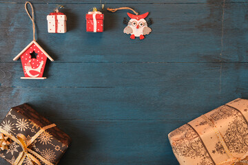 Christmas gift boxes on a blue surface viewed from above