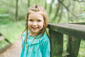 little girl in the summer on nature little girl