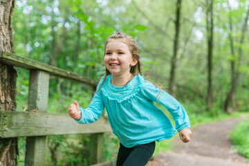 little girl in the summer on nature little girl run fast