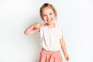 Little Smiling Curly Girl Brushing Teeth Portrait