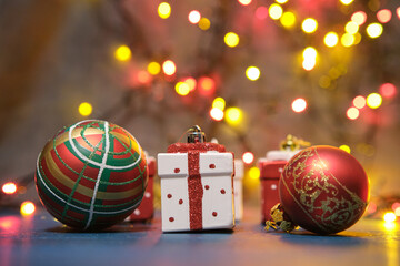 Christmas tree toys on a blue surface with a blurred background