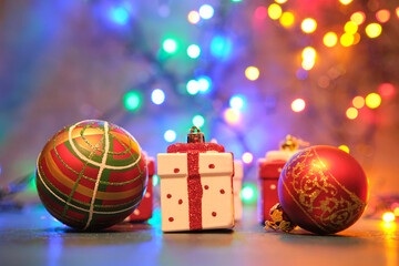 Christmas tree toys on a blue surface with a blurred background