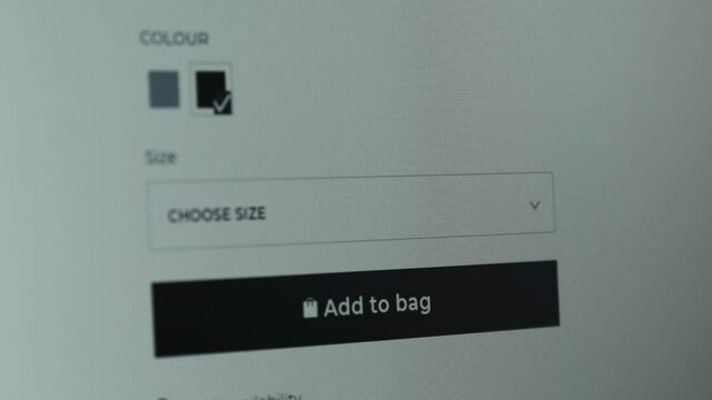 Buying goods in online store using PC. Pressing the Buy button to shop and pay online shopping on laptop. BUY button being pressed. Add to bag clothes. Black friday. Sale