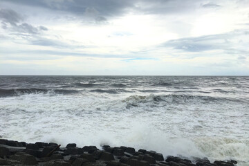 Waves rush to the Tetrapod on the Shonan coast where a typhoon is approaching
