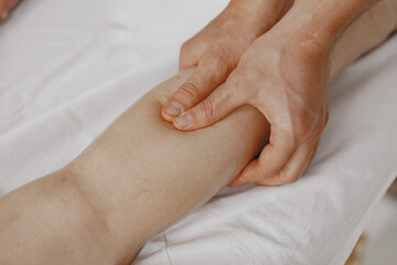 Man doctor do massage to female body