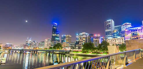 Stunning night skyline of Melbourne with river reflections