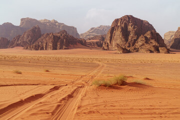 Wadi Rum desert, Jordan. The Valley of the Moon. Red sand, mountains and haze. Designation as a...