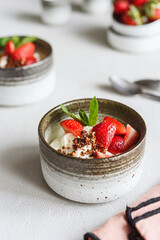 Strawberry, cream cheese and feta cream and crumble crust dessert. Homemade Sweet and salty cheesecake. Trifle. Selective focus