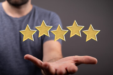 pointing five star symbol to increase rating of company