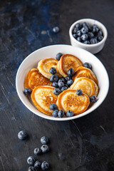 pancakes with blueberries fresh breakfast sweet dessert fresh portion ready to eat meal snack on the table copy space food background rustic. top view