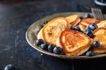 pancakes with blueberries fresh breakfast sweet dessert fresh portion ready to eat meal snack on the table copy space food background rustic. top view
