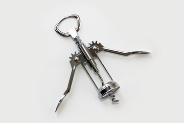 metal corkscrew for opening a wine bottle - obrazy, fototapety, plakaty