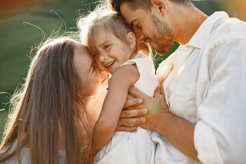 Family with little daughter in a mountains