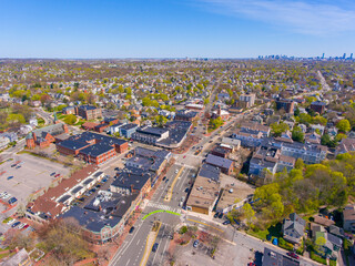 Arlington historic town center aerial view on Massachusetts Avenue at Mystic Street and Broadway with Boston at the background, Arlington, Massachusetts MA, USA. 