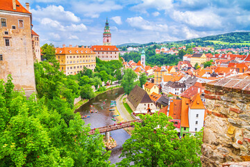 Fototapeta na wymiar Summer cityscape - top view of the Old Town of Cesky Krumlov and the Vltava river flowing through it, Czech Republic