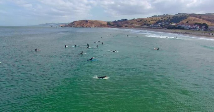 Aerial: Surfers in the water at Pacifica, San Francisco, California, USA