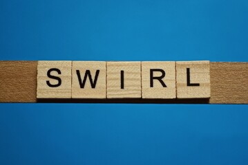 gray word swirl in small square wooden letters with black font on a blue background