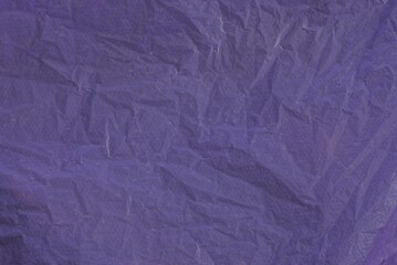 purple dark plastic background from a crumpled piece of cellophane