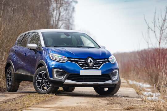 MOSCOW, RUSSIA - MARCH 12, 2021: new blue Renault kaptur suv crossover stands on road in nature