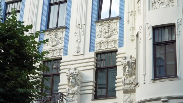 A view to the typical sculptural elements of Art Nouveau on one of the historical building facades on Alberta street in Riga, Latvia. The famous samples of Jugendstil decors.