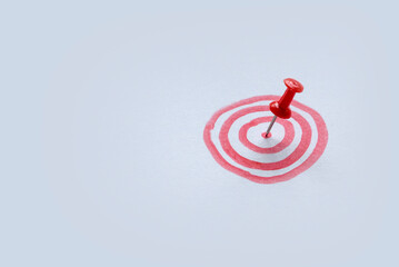 Selective focus the bullseye or bulls eye target or red dart circle with a red push pin on the...
