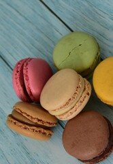 sweet macaron dessert on wood blue background