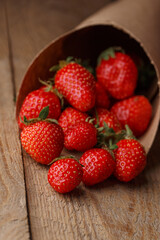 Strawberries - pile of strawberry on wooden table 