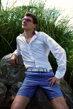 Portrait of man with moustache wearing dress shirt and pant in nature