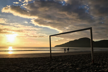 Silhouette of people at the beach during sunset