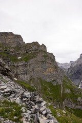 Fototapeta premium Amazing hiking day in the hearth of Switzerland. Wonderful scenery while climbing the summit and watching over the alps. Epic landscape.