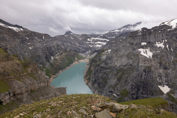 Amazing alpine lake called Limmerensee in the heart of canton Glarus in Switzerland. Epic view from the top of the mountain. Wonderful hiking day with good weather conditions.