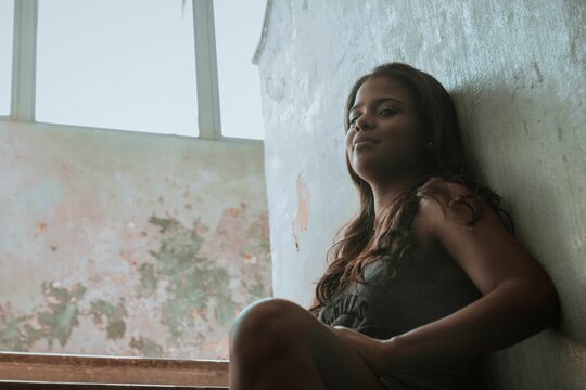 Woman sitting on staircase