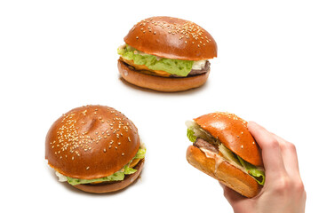 Hamburger in woman hands isolated on a white background.