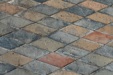 background stone from multicolored tiles square light and dark pattern