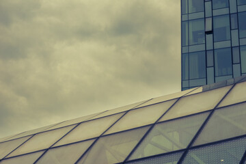 Cloudy landscape with glass buildings