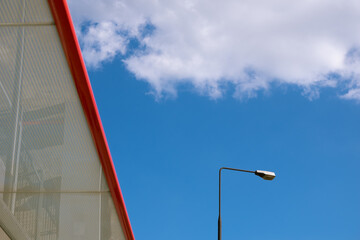 Fototapeta na wymiar Blue cloudy sky with street lantern