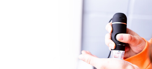 a portable computer and a microscope. computer microscope, manual microscope. Science, the future, forensic laboratory, research, distance education, online learning, home learning concept