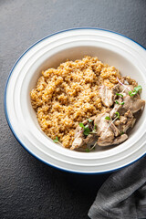 wheat porridge with boiled chicken meat, healthy food fresh portion ready to eat meal snack on the table copy space food background rustic. top view keto or paleo diet