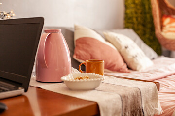 Smart snack with coffee bottle beside the bed.