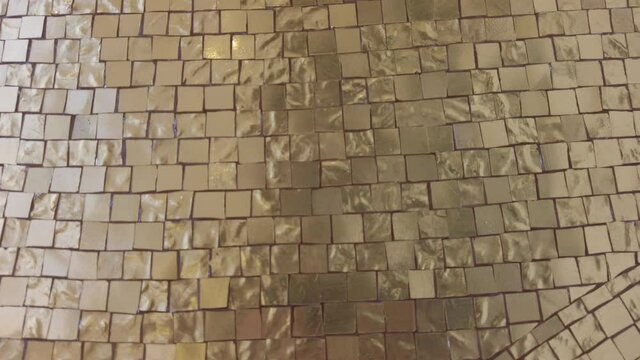 gold mosaic, set up at the Salone del Mobile in Milan