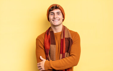 young teenager boy laughing shyly and cheerfully, with a friendly and positive but insecure attitude
