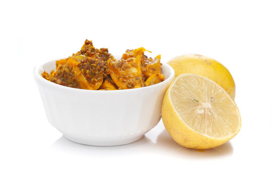 Close-up of Indian Organic pickle (Achar) made from Citrus Limon ( Lemon or Nimboo ). Very spicy, tart, acetic in taste and aromatic. A mixture of ayurvedic spices and herbs .