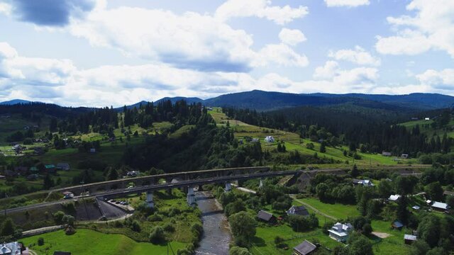 The viaduct in Vorokhta is a railway stone arch bridge across the Prut River aerial view