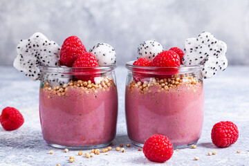 Smoothie with raspberries, banana, pitahaya, quinoa and almond milk.