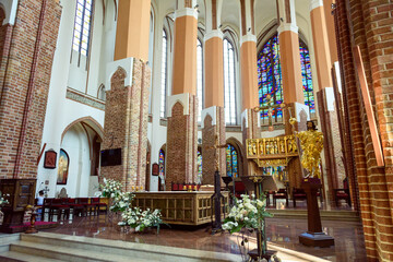 Naklejka premium Church sanctuary before a wedding ceremony. Empty chairs for bride and groom.