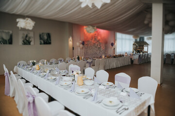 Beautifully decorated wedding table and other details at wedding hall. Wedding day.